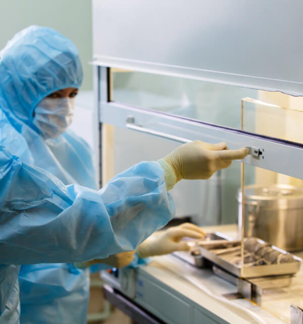 Employee operating lab equipment
